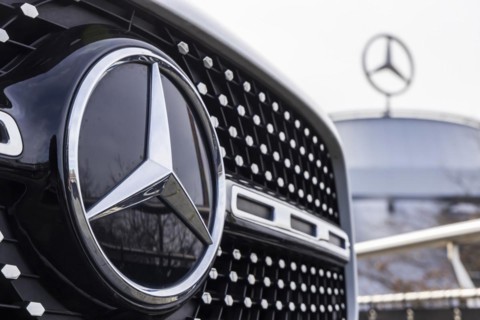 Mercedes, radiator grille and Mercedes star on a modern vehicle, in the background the Mercedes