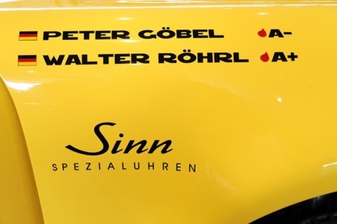 RETRO CLASSICS 2010, Stuttgart Messe, A yellow car with the names Peter Goebel and Walter Roehrl