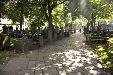 Lens flare, Graves in churchyard, Saint Nicholas Kirk, Aberdeen, Scotland, United Kingdom, Europe
