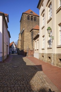 High cobbled street and tower of St Martin's Church in the old town of Minden, Muehlenkreis