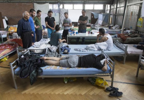 Refugees from Syria are housed in a gymnasium at the central contact point for asylum seekers in