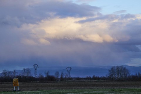 Weather change with mighty light to grey-blue clouds illuminated by the evening sun over the Black