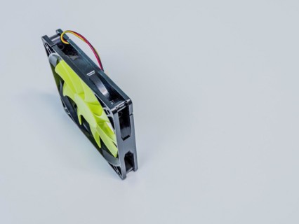 Green 120mm computer case fan with black frame and 3 prong pin power connection