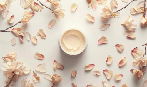 Creme jar blank mockup surrounded by delicate flower petals AI generated
