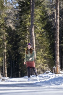 Ice skater, ice path through the forest, Sur En, Sent near Scuol, Engadin, Switzerland, Europe