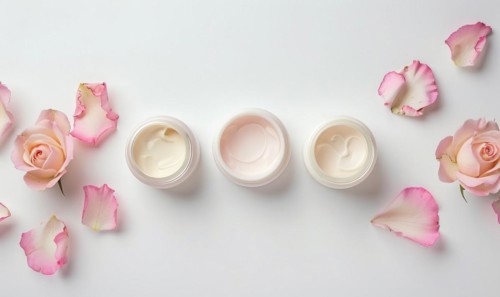 Three creme jar blank mockups nestled amidst delicate flower petals on a white background AI