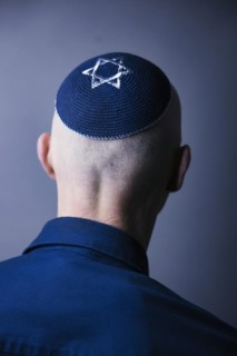 Jewish man wearing a kippa with a Star of David on his head, back view, studio shot, Germany,