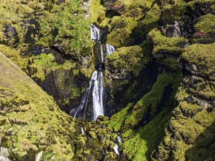 Waterfall in the rocks, near Vik, Sudurland, Iceland, Europe