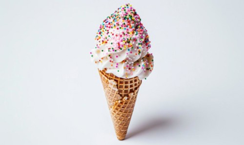 Ice cream cone with sprinkles on white background AI generated