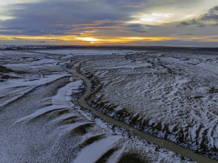 Overgrown river landscape, onset of winter, sunset, Fjallabak Nature Reserve, drone shot,