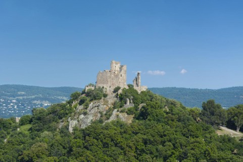 Landscape with the castle of Grimaud, in the background the hills of the Massif des Maures,