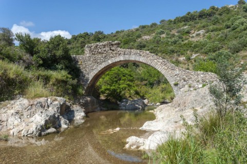 Historic arch bridge Le Pont des Fees over the river La Garde, Grimaud-Village, Var,