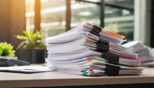 Several orderly stacks of documents with colourful paper clips on a desk, symbol bureaucracy, AI