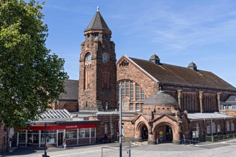 Historic Wilhelmine railway station, clock tower, pavilion with entrance to the station building,