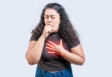 Girl with bronchitis coughing hard isolated. Young woman suffering from cough isolated