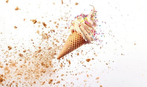 Ice cream cone explosion on white background AI generated