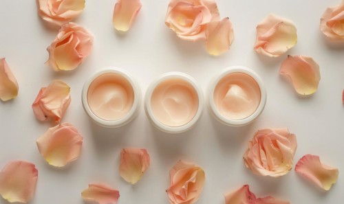 Three creme jar blank mockups nestled amidst delicate flower petals on a white background AI