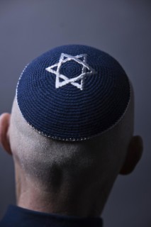 Jewish man wearing a kippa with a Star of David on his head, back view, studio shot, Germany,