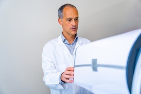 Ophthalmologist preparing an innovative laser machine to treat patients with glaucoma