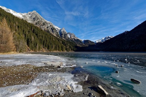 Ice rink in winter on an icy lake, Lake Antholz in the Antholz Valley, Val Pusteria, South Tyrol,