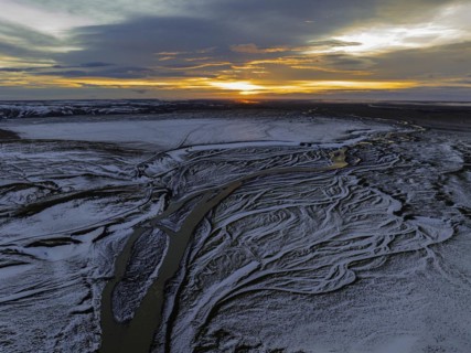 Overgrown river landscape, onset of winter, sunset, Fjallabak Nature Reserve, drone shot,