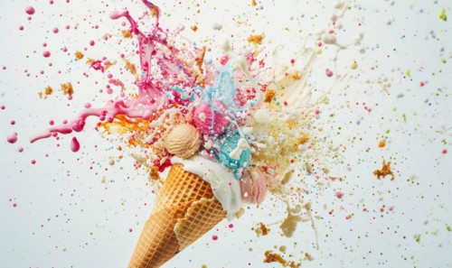 Ice cream cone explosion on white background AI generated