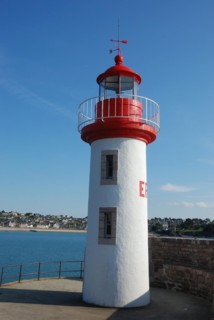 Lighthouse on a blue sky in Erquy