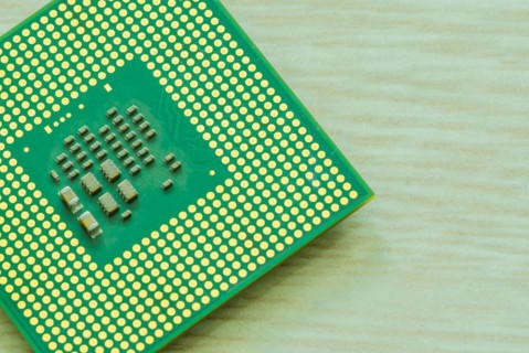 Bottom side of central processor unit (CPU) detailing the individual chips and gold connection pins