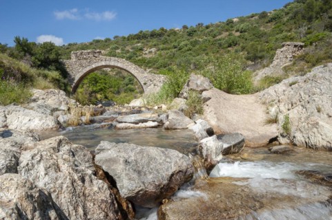 Historic arch bridge Le Pont des Fees over the river La Garde, Grimaud-Village, Var,