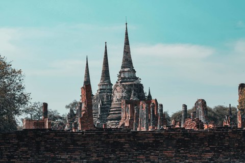 Old ruins in Wat Mahathat inside the famous heritage site of Ayutthaya Historical Park in Thailand.