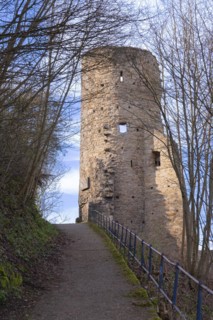 Steep path with blue railings from the castle hotel up to the ruins of Volmarstein Castle, remains