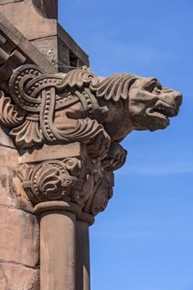 Gargoyle, demonic animal figure at the pavilion, historic Wilhelmine railway station, red