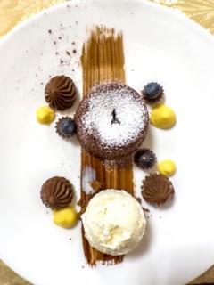 Elegant Design of a Beauty Chocolate Souffle Cake with Vanilla Ice Cream on Plate in Switzerland
