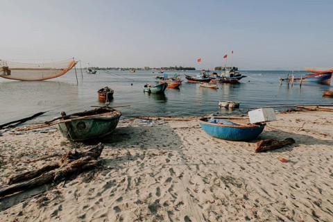 Scenic view of traditional Vietnamese fishing boats in Phan Thiet fishing village in Mui Ne,