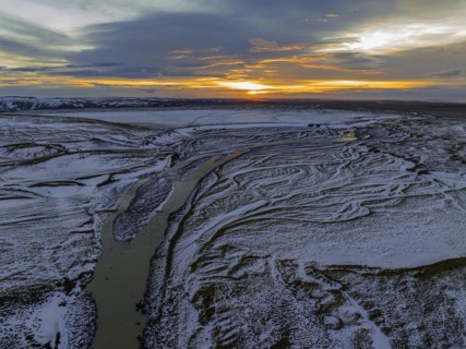 Overgrown river landscape, onset of winter, sunset, Fjallabak Nature Reserve, drone shot,