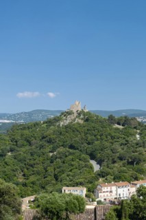 Landscape with the castle of Grimaud, in the background the hills of the Massif des Maures,