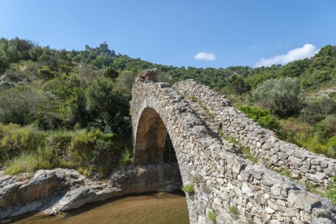 Historic arch bridge Le Pont des Fees over the river La Garde, Grimaud-Village, Var,