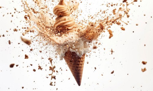 Ice cream cone explosion on white background AI generated