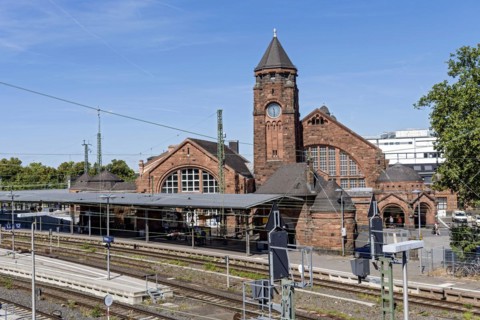 Historic Wilhelmine railway station, old and new parts, clock tower with station building and