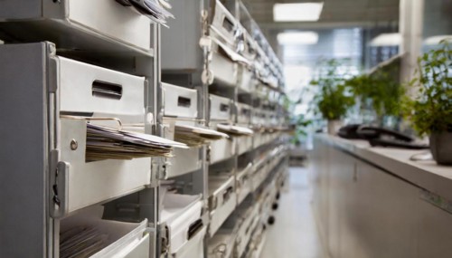 Metallic mailboxes filled with documents in a modern office, symbol bureaucracy, AI generated, AI