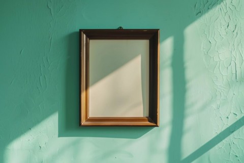 Empty dark wooden picture frame on green wall. KI generiert, generiert, AI generated