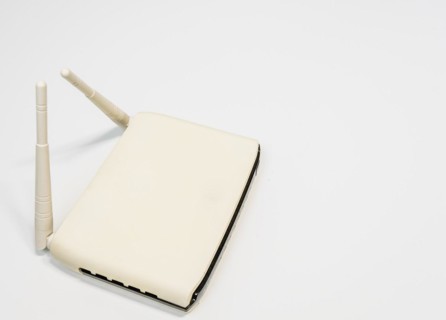 White wireless router with two antenna for home computer network