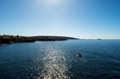 View of the sea with fishing boat from the Mirador de les Malgrats near Santa Ponca or Santa Ponsa,