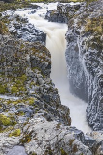 Rushing stream plunges into a narrow gorge, Fjallabak Nature Reserve, Sudurland, Iceland, Europe