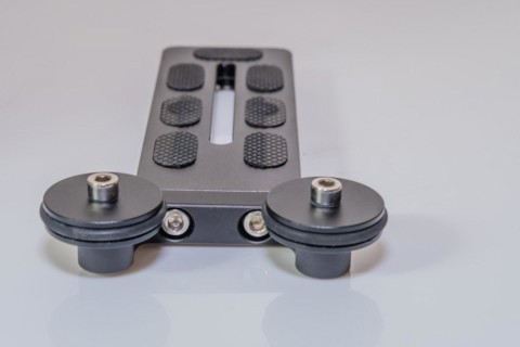 Closeup of end plate of lens support on tripod head for use with large zoom lens