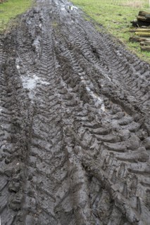 Tractor tyre tracks in softened soil on a farm, Mecklenburg-Vorpommern, Germany, Europe