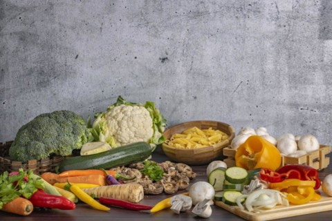 Various fresh vegetables such as peppers, cauliflower, peppers, mushrooms, broccoli and pasta next