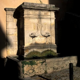 Dolphin fountain in Bonnieux, Luberon, Vaucluse, Provence, France, Europe