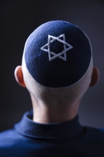 Jewish man wearing a kippa with a Star of David on his head, back view, studio shot, Germany,
