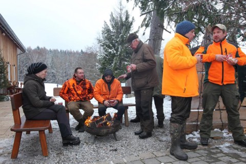 Wild boar (Sus scrofa) end of the hunt, amusing hunter's round, so-called Schuesseltreiben,